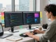 Build internal tools with AI in a modern software development workspace with vibrant coding screens and creative elements.